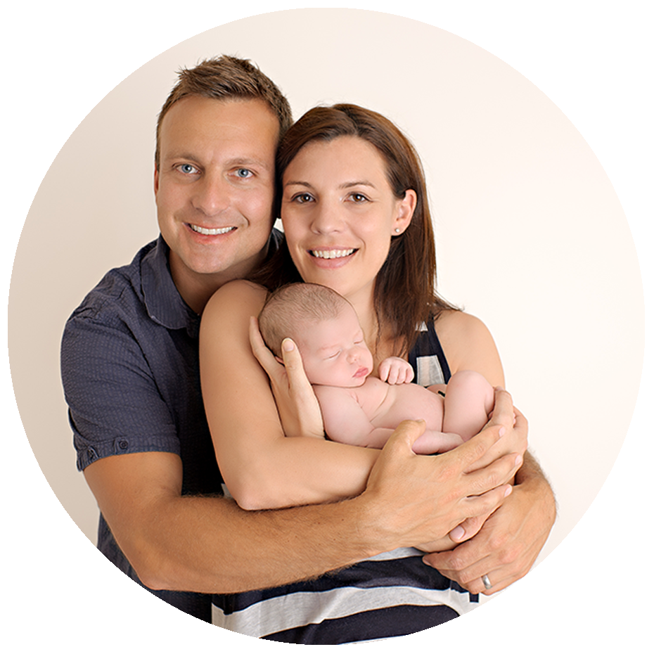Beautiful infant Photography in Jupiter Florida: a mom and dad posing with a newborn baby at a photography family session