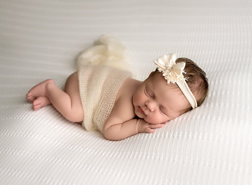 Newborn's sweet expressions captured by a Tequesta, Florida photographer.