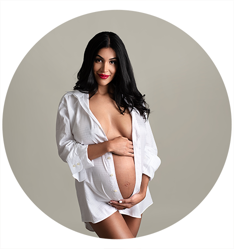 beautiful maternity model posing with a white men's shirt